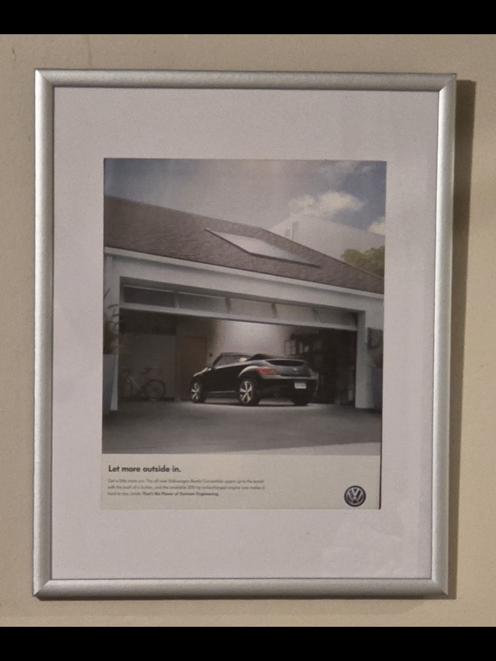 This is a framed ad from Volkswagon "Let More Outdoor In"  2013 8"x10"